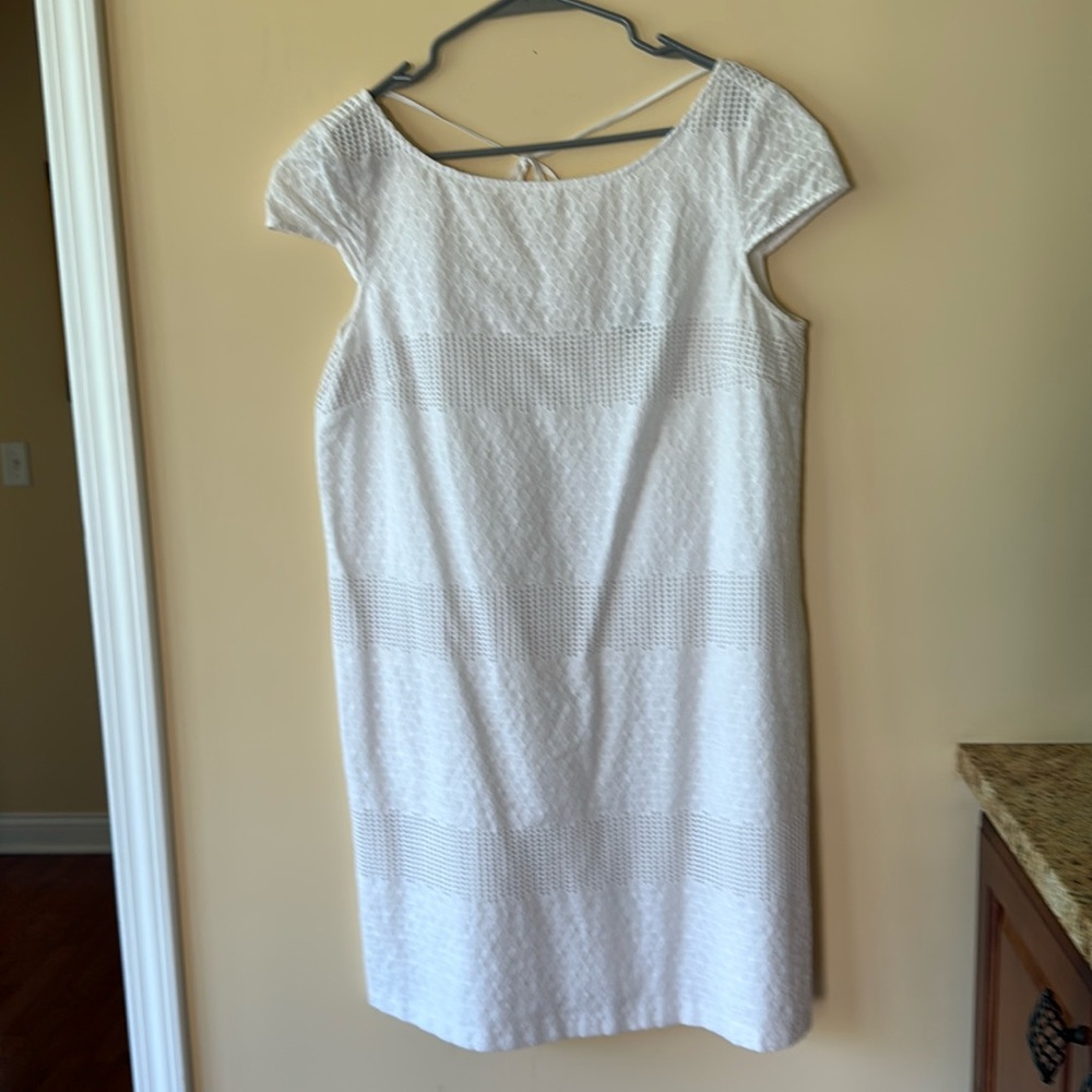 White cotton knee length dress.
